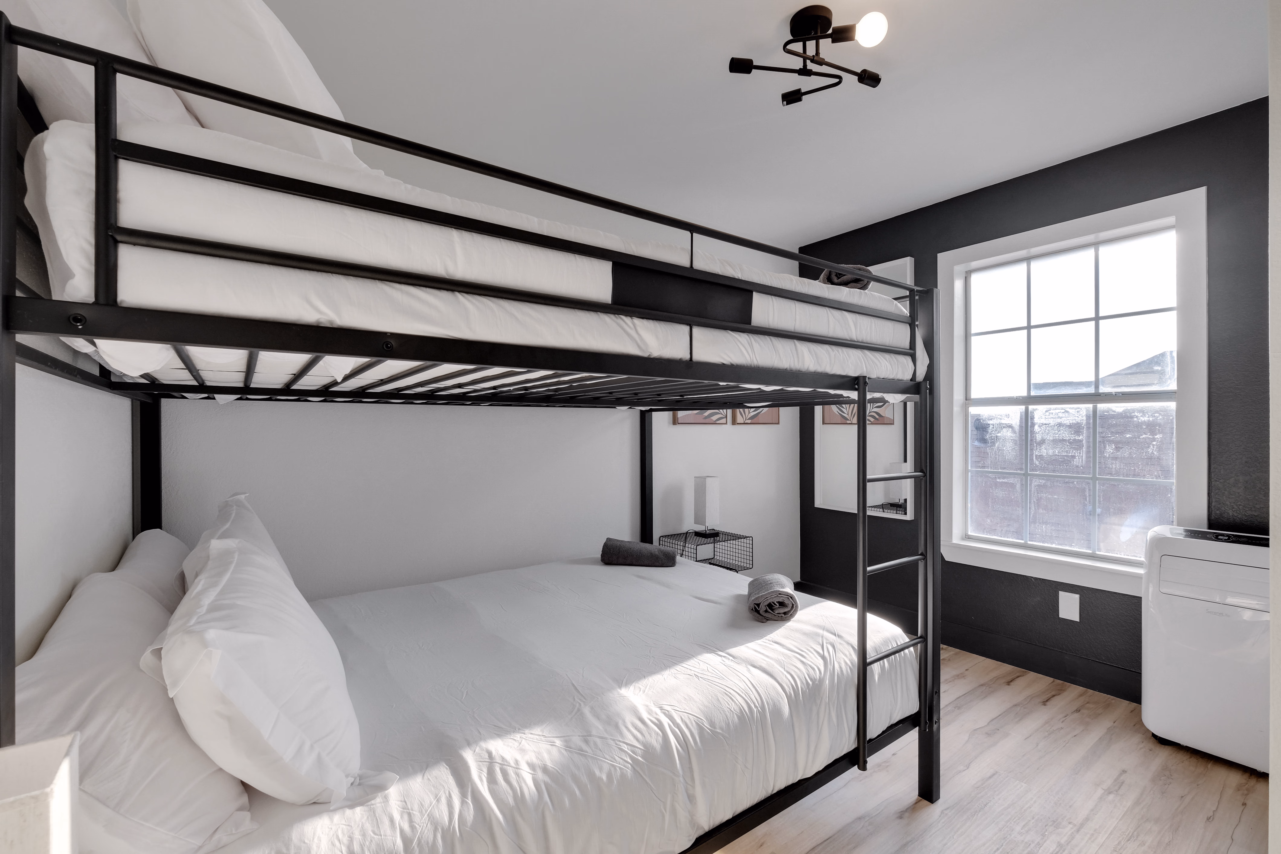 Bunk room — twin-over-full bunk and queen bed combo.