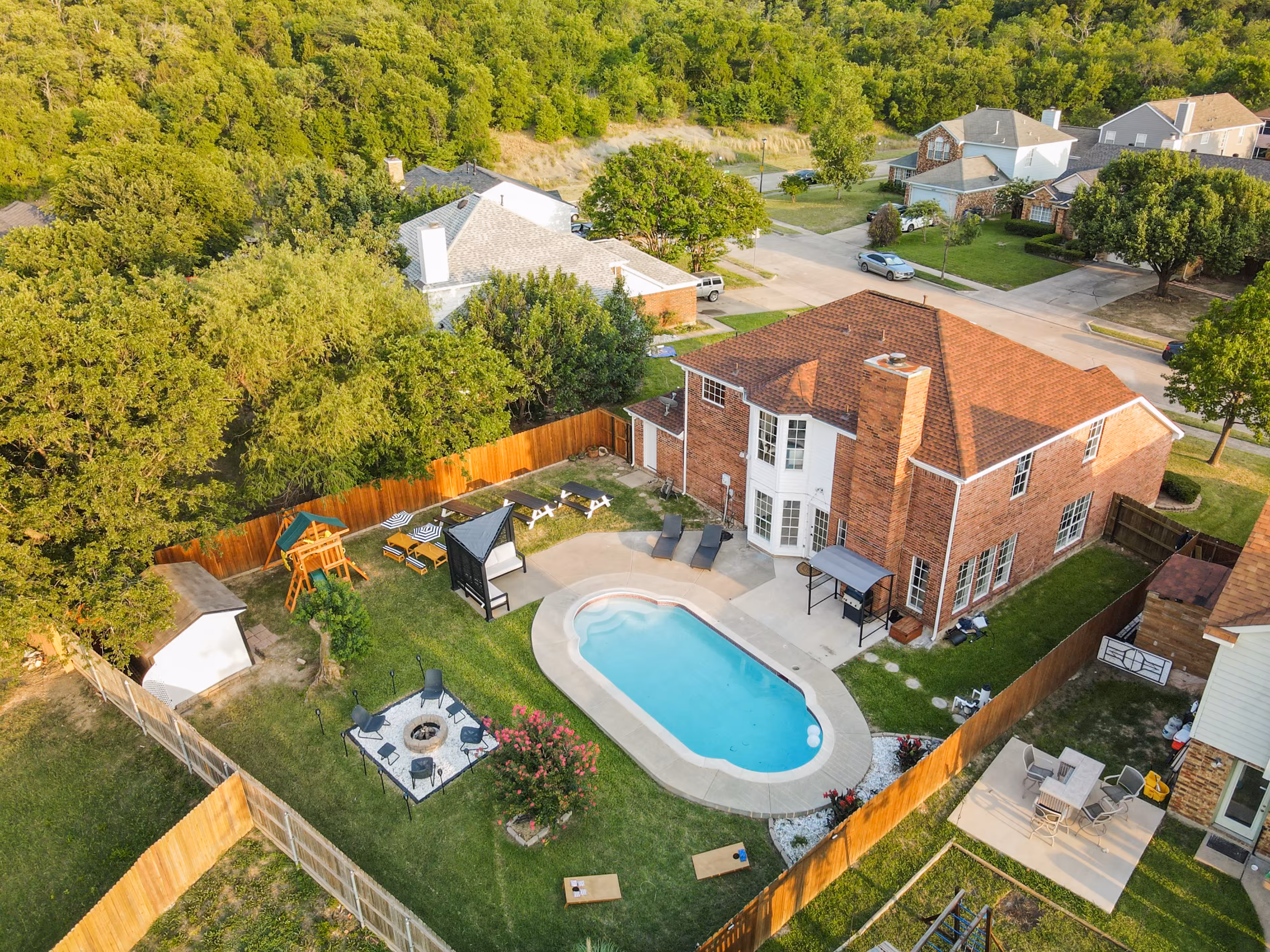 Aerial overhead — full backyard pool and amenities layout.